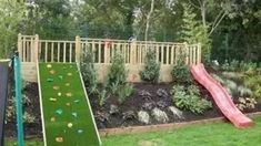 a backyard with a slide and artificial grass