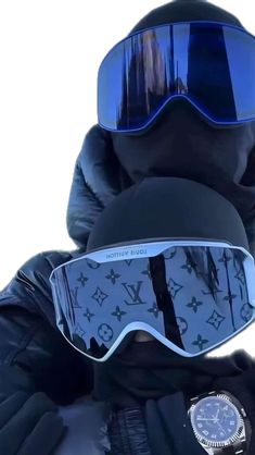 a person wearing ski goggles and a watch