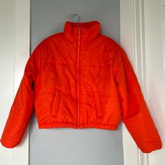 Brand: New Look Size: L Color: Orange Puffer Jacket With Collar, Zipper And Pockets Made In China Material: Shell - 100% Polyester, Backing - Pa Coating, Lining - 100% Polyester, Filling - 100% Polyester Machine Wash Measurements: 19” Front Center Length, 20.5” Back Center Length, 23” Sleeve Length, 19” Shoulder To Shoulder, 24” Armpit To Armpit Retail Price: $79 Condition: New With Tags Casual Puffer Outerwear For Work, Casual Puffer Jacket With Zipper For Work, Casual Hooded Puffer Jacket For Work, Casual Workwear Puffer Jacket, Sporty Spring Puffer Outerwear, Spring Hooded Puffer Jacket For Workwear, Orange Hooded Outerwear For Spring, Trendy Spring Puffer Jacket For Work, Spring Outdoor Puffer Jacket