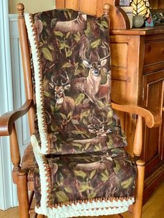 a rocking chair with a deer blanket on it