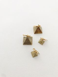 Beautiful 3D brass pyramids on gold-filled hoops. •Small Pyramid 0.55”•Large Pyramid 0.90” *Lightweight & perfect for daily wear, brass symbols will require occasional polishing. Packaged for gift giving. *Sold individually. Gold Geometric Metal Jewelry, Gold Geometric Brass Jewelry, Adjustable Geometric Gold Jewelry, Nickel-free Gold Triangle Jewelry, Geometric Gold Nickel-free Jewelry, Nickel-free Geometric Gold Jewelry, Gold Triangle Metal Jewelry, Gold Geometric Nickel-free Jewelry, Adjustable Gold Triangle Earrings