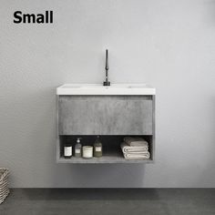 a white sink sitting under a bathroom mirror next to a towel dispenser