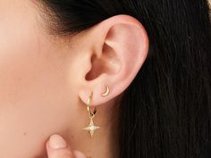 Sell as a pair - Small Hoop earrings in 14k gold with brass. This pair of hoop earrings come in star shaped charm with natural opal or Turquoise . The shiny stones on the charm are cubic zirconia. They are very tiny and versatile to wear with any earrings in the same ear. These modern and minimalist style earrings fit very well everyday looks Details: * Crafted in 14k Gold plated brass. Nickel free. * 2 units. * Super lightweight Measures: Hoop: 13mm diameter Charm diameter: 13mm - All the piece Celestial Huggie Pierced Earrings, Celestial Star Huggie Earrings, Celestial Single Earring For Everyday Wear, Celestial Tarnish-resistant Earrings For Everyday, Elegant Hypoallergenic Star Hoop Earrings, Celestial Style Tarnish Resistant Earrings, Dainty Star-shaped Jewelry For Pierced Ears, Celestial Pierced Huggie Jewelry, Celestial Huggie Pierced Jewelry