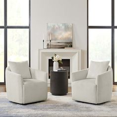 a living room with two chairs and a table in front of a fire place on the floor