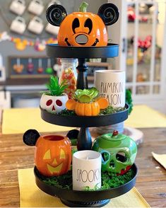 three tiered tray with halloween decorations on it