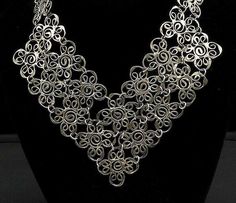 925 Sterling Silver - Vintage Dark Tone Spiral Flower Chain Necklace - NE3311  Jewelry Type:         Necklace   Metal Type:            925 Silver   Metal Size:             22.75" Length  2.75" Height   Stone Type:            N/A  Condition:              N/A  Jewelry Weight:     62.4 Grams  PLEASE NOTE: THIS ITEM IS PRE-OWNED. ALTHOUGH MOST ITEMS ARE IN VERY GOOD CONDITION, SOME MAY NEED CLEANING AND/OR MINOR REPAIRS. WE MAKE A VERY STRONG EFFORT TO UPLOAD CLEAR PICTURES. PLEASE INSPECT ALL PICTU Silver Flower Necklaces For Party, Silver Necklace With Flower Shape For Party, Silver Flower-shaped Necklace For Parties, Silver Flower Shaped Necklace For Party, Silver Spiral Bohemian Necklace, Bohemian Silver Spiral Necklace, Silver Metal Necklace In Flower Shape, Elegant Silver Spiral Necklace, Elegant Spiral Filigree Jewelry