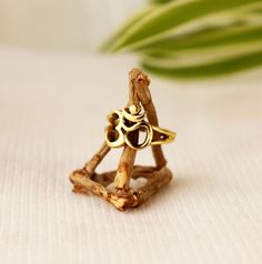 "Ohm symbol Ring made in brass.   Size : You can select Your favorite stone from variations up to \"Add to cart\"  EU:   /  US:  47    /   4  49   /  4 3/4   50   /  5   51   /  5 3/4  52   /  6   54   /  7  56   /  7 1/2   57   /  8                    58  /   8 1/2  59  /   8 3/4  60 / 9  This model is also available in Silver plated at the following link: https://www.etsy.com/listing/708253906/ohm-ring-with-om-symbol-jewelry-with-ohm?ref=shop_home_active_17&frs=1 The ring is made of made of high quality brass 100% Nickel free. The brass will develop a nice antique color over time. I suggest cleaning once in a while for getting back to original color. You can use natural ingredients like lemon or vinegar with water.  All jewelry comes in beautiful handcraft bags. Gift ready !   !! SHIPMEN Spiritual Rings As Festival Gifts, Spiritual Rings For Festivals Gift, Adjustable Spiritual Rings, Gold Spiritual Stackable Toe Rings, Spiritual Gold Stackable Rings, Gold Stackable Adjustable Spiritual Rings, Adjustable Gold Stackable Spiritual Rings, Ohm Ring, Ohm Jewelry