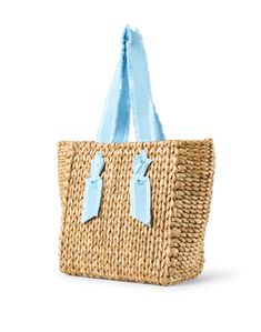 Pamela Munson's Isla Bahia tote bag is an endlessly versatile accessory you'll be carrying all season. Woven from corn husks and finished with sweet grosgrain handles, this lined carryall is just as perfect for the beach as it is for lunch with the ladies. Style it with all of your favorite casual warm weather ensembles. Beige Straw Shopping Bag With Handle Drop, Natural Top Handle Straw Bag With Handle Drop, Chic Tote Straw Bag With Handle Drop, Natural Top Handle Bag With Handle Drop, Blue Top Handle Straw Bag For Shopping, Blue Top Handle Straw Bag For Everyday Use, Blue Top Handle Straw Bag For Travel, Travel Straw Bag With Double Rolled Handles, Straw Bags With Rolled Handles For Shopping