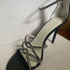 Nwt Galina Signature Entwined Crystal Satin Stilettos Black Size 7.5 Description: Barely There Straps, Encrusted With Glittering Crystals, Twine At The Toe And Encircle The Ankle Of This Spiky Satin Pair. Galina Signature, Exclusively At David's Bridal Satin, Synthetic 4" Heel Back Zipper Imported Black Matches Hbtassi Clutch; Ivory Matches Hbclea Clutch Davids Bridal, Twine, Size 7, Satin, Women Shoes, Zipper, Crystals, Heels, Women Shopping