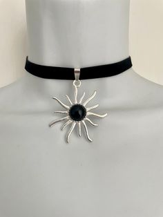 Black velvet choker ribbon with Tibetan silver sun pendant and black onyx gemstone.  12 inch/30cm long black cotton chocker cord with a 5cm/2 inch extension chain. Can be made longer or shorter if you need, just message me 💕 The sun measures approximately 5cm long (2 inches) The black velvet ribbon is 15mm wide. The sun is made from Tibetan silver, it will stay nice and bright and won't tarnish over time ---------- SHIPPING AND PACKAGING I aim to dispatch all orders within 1-2 days. I've been t Black Velvet Choker Necklace, Black Velvet Ribbon, Velvet Choker Necklaces, Black Velvet Choker, Sun Pendant, Velvet Choker, Onyx Gemstone, Velvet Ribbon, Display Cards