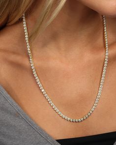 Our iconic simulated diamond baroness necklace is our modern take on the classic tennis style necklace and is now available in 21.5 inches. This iconic tennis style necklace features 122 simulated diamonds in bezel settings throughout. DETAILS: Tennis Necklace Length: 21.5" 122 stones Latch Clasp SKU: N4835 MATERIALS: 18k Gold Plated Over Brass Stone: 3mm Simulated Diamonds Luxury Hammered Diamond Necklace, Luxury Bezel Set Tennis Necklace, Melinda Maria Jewelry, Melinda Maria, Tennis Style, Tennis Necklace, Champagne Gold, Style Necklace, Necklace Length