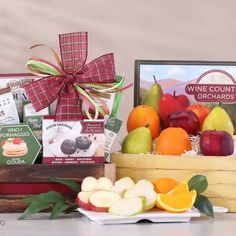 an assortment of fruit and wine gift baskets