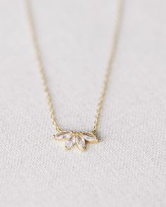 This stunning Gold Crystal Flower Necklace is crafted from gold vermeil with a beautiful crystal flower. measures 17.75" at longest, 15.75" at shortest Elegant Gold Plated Clavicle Chain Crystal Necklace, Elegant Gold Plated Crystal Clavicle Chain Necklace, Elegant Gold Plated Crystal Clavicle Necklace, Elegant Gold-plated Crystal Clavicle Necklace, Elegant Gold Plated Clavicle Chain Necklace, Elegant Rose Gold Crystal Necklaces With Adjustable Chain, Gold Crystal Necklace With Adjustable Chain For Formal Occasions, Elegant Rose Gold Crystal Necklace With Adjustable Chain, Elegant Rose Gold Crystal Necklace With Delicate Chain