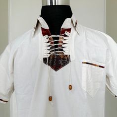 MADE IN MEXICO SELLING ONLY BY COLOR. We've received a large quantity of guayaberas imported from Mexico.The embroidery pattern might be different from the picture.But you will receive a genuinely unique, beautiful, detailed guayabera. For: Men Size: Large ( Chest: 40-42"; Length: 28-29") Color: off-white Details: 100% Linen Classic Fit Short Sleeve 1 Front Pocket Machine Wash - please wash before wearing Washing Instructions: One thing to remember when washing a guayabera shirt is to wash it wi Summer T-shirt With Placket And Short Sleeves, White Cotton T-shirt With Henley Neckline, White Casual Half Sleeve Shirt, Casual Short Sleeve Button T-shirt, Casual Cotton T-shirt With Johnny Collar, Casual Short Sleeve Buttoned T-shirt, Collared Cotton T-shirt For The Beach, Casual White Half Sleeve Shirt, Brown Cotton Short Sleeve Shirt For Summer