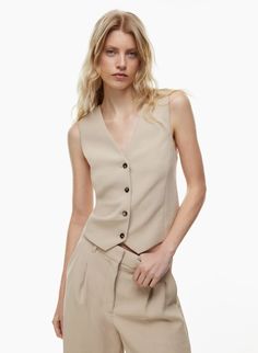 PESCI VEST | Aritzia Sleeveless Business Vest With Hidden Button Closure, Semi-formal Sleeveless Vest With Hidden Button Closure, Semi-formal Vest With Hidden Button Closure, Tailored Vest Top For Business Casual, Business Vest With Hidden Button Closure, Semi-formal Sleeveless Vest With Button Closure, Spring Business Vest With Button Closure, Spring Semi-formal Vest With Hidden Button Closure, Sleeveless Semi-formal Spring Top