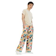 Get the Comfort of Pajamas in Style Upgrade your loungewear game with our all-over print unisex wide-leg pants. Made from premium knit mid-weight jersey fabric, these pants offer the perfect combination of comfort and style. The retro abstract geometrical pattern adds a touch of nostalgia to your wardrobe, making it a must-have for any fashion-forward individual. Designed for both men and women, these pants feature a relaxed fit and practical side pockets for added convenience. The elastic waist Casual Multicolor Pants With Elastic Waistband, Casual Multicolor Straight Leg Pants, Multicolor Relaxed Fit Trousers, Multicolor Relaxed Fit Straight Pants, Multicolor Straight Pants With Relaxed Fit, Multicolor Relaxed Fit Sweatpants, Casual Multicolor Loungewear Bottoms, Casual Multicolor Trousers, Casual Multicolor Ankle Pants