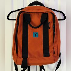 Orange Backpack With Blue Windmill Dutch Bros Logo. Laptop Pocket Inside As Well As Smaller Pocket In The Front. Orange Backpack With Adjustable Strap For Everyday Use, Orange Everyday Backpack With Adjustable Strap, Functional Orange Backpack For School, Casual Orange Backpack Bag, Casual Bags For Everyday Use, Orange Backpack For Daily Use, Orange Travel Bag For Back To School, Orange Travel Backpack With Zipper Closure, Rectangular Orange Backpack For Everyday Use