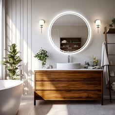 a bathroom with a large round mirror above the sink and a bathtub next to it