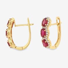 Our gemstone earrings are impeccably crafted. Set in 18K white or yellow gold, they feature regal red oval-cut Rubies intricately encompassed by a halo of round brilliant-cut Diamonds. Add an extravagant yet subtle splash of color to any ensemble! This piece really pops when paired with other rubies from our Gemstone Collection. Natural Rubies: 1.30ctw Natural Diamonds: 0.20ctw 18K White or Yellow Gold Length: 1.5 Inches Elegant Halo Lab-created Ruby Jewelry, White Gold Ruby Earrings With Halo Design, Ruby Halo Setting Earrings Fine Jewelry, Ruby Halo Setting Earrings, Round Lab-created Ruby Earrings Fine Jewelry, Diamond Halo Earrings, Piercing Stud, Crafted Earrings, Halo Diamond Earrings