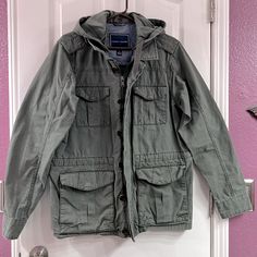 Tommy Hilfiger Men’s Green Military Jacket With Hood. Most Likely Never Worn, In Excellent Condition. Casual Winter Parka With Patch Pockets, Tommy Hilfiger Cotton Fall Outerwear, Tommy Hilfiger Cotton Outerwear For Fall, Hooded Sport Coat With Pockets For Spring, Hooded Spring Sport Coat With Pockets, Casual Hooded Sport Coat For Spring, Spring Hooded Outerwear With Patch Pockets, Tommy Hilfiger Winter Outerwear With Pockets, Winter Tommy Hilfiger Outerwear With Pockets