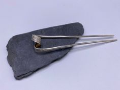 "The inspiration for this item comes from traditional Thai hairpin that women used to wear for special occasions, such as Thai festivals, Thai dance or weddings.  It is made of a single solid silver piece, hammered to create textures in the middle part, that is twisted and folded into the final shape of the hairpin. Simple yet sophisticated, you can use it as an everyday detail as well as that \"something special\" piece to make your hairdo stand out." Thai Dance, Silver Wire Rings, Silver Hair Pin, Silver Gift Wrap, Hair Jewellery, Silver Silk, Silver Earrings Handmade, Middle Part, Silver Gifts