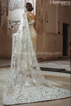 Buy Latest Pakistani Saree Online a gorgeous masterpiece in Ivory color adorned with stones and beads. Net Saree is perfectly elegant for your Big day Elegant Off White Dupatta For Reception, Elegant Off-white Dupatta For Reception, Elegant Saree Wedding Dress With Dupatta, White Saree With Pearl Embroidery For Reception, Elegant Semi-stitched Wedding Dress, Wedding Saree With Pearl Embroidery And Traditional Drape, Semi-stitched Elegant Wedding Dress For Designer Wear, Elegant Hand Embellished Wedding Dress With Traditional Drape, Bollywood Style White Saree With Pearl Embroidery