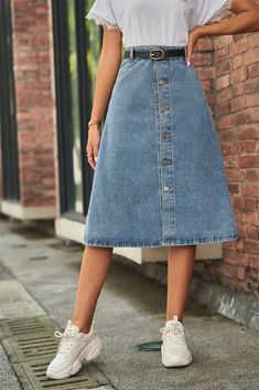 Introducing our Button Front A-Line Denim Skirt, the perfect addition to your casual wardrobe. This unique skirt features a solid pattern and a flattering A-line hem shape, giving it a stylish and versatile look. Made from a blend of 95% rayon and 5% polyester, this skirt is both comfortable and durable. The standout feature of this skirt is the button front design, adding a touch of vintage charm to the overall look. It also comes in a midi length, making it suitable for various occasions. And