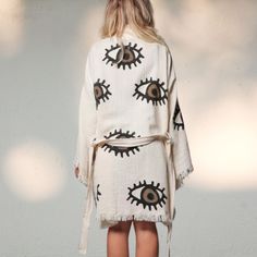 Embrace the timeless style of the Eye of The Beholder kimono kaftan! With its 100% organic cotton and evil eye motif, it's the perfect cover-up for all your summer needs. Stay cool, comfy, and breezy, whether you're beach-bound, exploring the park, or lounging at home. Featuring a soft, light, and fluffy construction with an adjustable waist belt, this wardrobe essential is just what you need! One Size Fits Most Oversized Cotton Cover-up For Summer, White Cotton Kimono For Summer, Cotton Kimono With Kimono Sleeves For Beach Cover-up, Oversized Cotton Kimono For Festivals, Oversized Cotton Kimono For Vacation, Cotton Kimono With Relaxed Fit For Vacation, Relaxed Fit Cotton Kimono For Vacation, Oversized Cotton Summer Robe, Hippie Summer Kimono For Loungewear