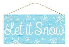 a sign that says let it snow hanging from a rope with snowflakes on it