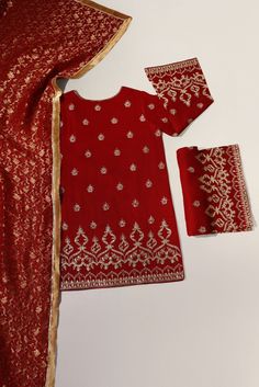 Maroon pure raw silk 58 gms embellished with zari and clusters of sequins on a short length kameez with hand/Ada buttons on neckline, styled with flappers and pure banarsi chiffon dupatta. The length of the Kameez is 36 inches. ( Shade number 4343 ) Order Duration: 4 to 6 weeks Festive Silk Salwar Kameez With Zari Work, Festive Unstitched Chinon Suit, Festive Raw Silk Unstitched Suit, Festive Unstitched Suit With Dabka And Traditional Drape, Red Churidar With Sheer Dupatta In Chinon, Festive Chinon Unstitched Suit, Traditional Drape Silk Lawn Suit For Festive Occasions, Silk Lawn Suit With Traditional Drape For Festive Occasions, Festive Unstitched Dola Silk Suit