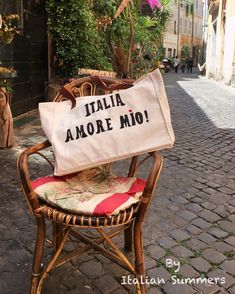 a chair with a bag on it that says italia amore mio in italian