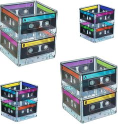 four different colored cassettes stacked on top of each other