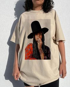 Vintage Erykah Badu tee, Erykah Badu fans Shirt , Erykah Badu Graphic , Erykah fans, Erykah  tour Gift for men women unisex tshirt  Heather colors are 52% combed and ring-spun cotton, 48% polyester - Athletic and Black Heather are 90% combed and ring-spun cotton, 10% polyester - Solid Colors 100% pre-shrunk cotton - Fiber content may vary by color FOR THE BEST FIT; (See Size Chart in Images). 1) Lay a t-shirt on a flat surface. 2) Measure the chest area, just under the armpit from side to side f Cute Comfy Outfits Black Women, Bohemian Style Black Women, Vintage Tshirt Outfit, Erica Badu, Nubian Style, March Aesthetic, Erykah Badu, Fan Shirts, Cute Comfy Outfits