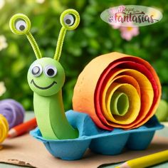 a close up of a toy snail on a table