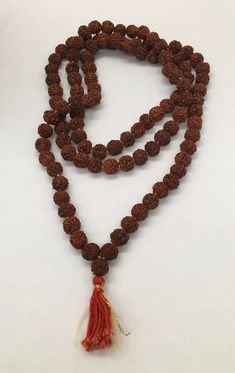 "Beautiful vintage genuine quandong seed bead necklace or prayer bead necklace good pre/owned measures 19\" across and 38\" overall length." Traditional Hand Knotted Necklaces For Meditation, Spiritual Hand-strung Beaded Necklaces For Rituals, Artisan Hand-knotted Beaded Necklaces For Meditation, Brown Hand Knotted Mala For Healing, Traditional Brown Hand Knotted Necklace, Hand Knotted Brown Mala For Healing, Vintage Beaded Necklaces With Round Beads For Meditation, Beaded Mala With Round Beads For Rituals, Brown Beaded Mala With Spiritual Style