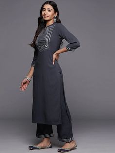 Grab this beautiful 3-piece set. The set comes with gota embroidered straight shape kurta has mandarin collar, 3/4th flared sleeves & calf length teamed with solid trouser pant with slip on closure & elasticated waistband and a dupatta. Color - Grey Kurta Fabric-Cotton Blend Pant Fabric-Cotton Blend Dupatta Fabric - Silk Chiffon Neck-Mandarin Collar Sleeves-3/4th Sleeves Work - Gota Embroidery Detailing Washing Instructions-Dry Clean DISCLAIMER - The color of the product may be differ due to scr Grey Kurta, Gota Embroidery, Formal Jewelry, Embroidery Detailing, Chiffon Dupatta, Fabric Silk, Churidar, Suit Set, Fabric Shop