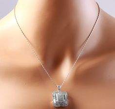 Splendid 7.28 Carats Natural VVS Diamond 18K Solid White Gold Necklace Stamped: 18K (Pendant) 14K(Chain) Suggested Replacement Value $14,590.00 This necklace is in perfect condition and looks like new. Total Natural Round, Baguette & Princess Cut White Diamonds Weight: 7.28 Carats (color F-G / Clarity VVS1-VVS2) Chain Length is: 18 inches Pendant Measures: 23.4 x 20.4mm Total item weight is: 12.1 grams Disclaimer: all weights, measurements and colors are approximate and may vary slightly fro White Gold Pendant Necklace, Vvs Diamond, White Gold Necklace, White Gold Pendant, White Gold Necklaces, Gold Pendant Necklace, Quality Diamonds, Princess Cut, Estate Jewelry