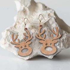 wooden deer earrings with antlers on them