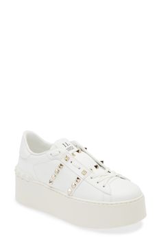 Signature pyramid studs shine across the leather upper of this Italian-crafted platform sneaker refined with an innovative lacing technique. 2" heel (51mm); 1 1/2" platform (size 38.5) Lace-up style Leather upper and lining/synthetic sole Made in Italy Designer Shoes Luxury Studded Platform Sneakers With White Sole, Luxury Low-top Platform Sneakers With Studded Outsoles, Luxury Leather Platform Sneakers With Studded Outsoles, Low-top Leather Sneakers With Studs, Luxury White Studded Sneakers, Designer Studded Low-top Sneakers, Luxury Studded Lace-up Sneakers, Luxury Round Toe Platform Sneakers, Designer Low-top Platform Sneakers