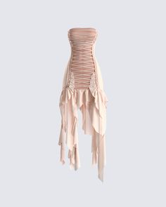 a pink dress with ruffles hanging from it's back and the bottom