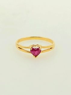 Beautifully vintage 1990s handcrafted 14K yellow gold ring. There is a natural ruby placed in the center of this ring which is heart shaped. Split Shank ring This gorgeous ring is a great gift idea for Valentine's Day, anniversary or a birthday celebration.  Ring size: 1 1/2 (sizeable upon request) Total ruby weight approx: 0.10 ct Total ring weight: 0.7g Hallmarks: 14K HABCO Will be placed into a suitable gift box Free shipping within the U.S. Valentine's Day 14k Gold Ruby Ring, Gold Ruby Ring For Valentine's Day, 14k Gold Heart-shaped Ruby Ring For Promise, 14k Gold Heart-shaped Ruby Promise Ring, Valentine's Day Gold Ruby Ring, Valentine's Day 14k Gold Ruby Ring Fine Jewelry, Yellow Gold Heart-shaped Ruby Ring, Heart-shaped Yellow Gold Ruby Ring, Heart-shaped Yellow Gold Birthstone Ring