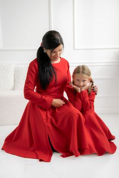 "Red matching dresses, the unforgetable dresses that you will always remember!  Where them as your mommy and me Christmas dresses, or for other special occasions you attend to, one thing is for sure, you'll have a matching dress with your daughter, so everyone eyes will look only at you!  ❤ MADE ESPECIALLY FOR YOU The dresses are made from a soft fabric, with a zipper on the back.  The mother dress has a midi skirt with decorative buttons. The daughter dress has a full circle skirt for more volume and twirling. The dresses can be made on almost any colour, contact me for details. ❤ MATCHING SETS The listing is for a matching set with your daughter, so you will receive two complete outfits. ❤ SIZE Please check chart size here before placing your order or contact me for any details. ❤ DETAIL Red Dresses Long Sleeve, Red Dresses Long, Mommy And Me Christmas, Daughter Dress, Mother Dress, Matching Clothing, Red Dress Long, Red Long Sleeve Dress, Christmas Dresses