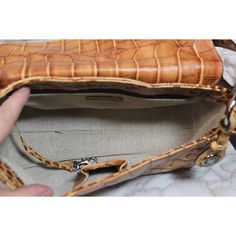 This classic Dooney & Bourke shoulder bag measures approximately 6” x 12” x 4”. This is a used bag with minimal wear. Please closely inspect all photos before purchasing. Closure: Snap Strap Drop: 9” Color: Brown Pockets: 2 Interior & 2 Exterior Material: Leather Style: Shoulder Bag Photos are Actual pictures, not stock photos. Authenticity Note: We have been trained to spot fake designer bags, and closely inspect each purse to verify authenticity. If we have any doubts, we NEVER sell it. That s Formal Rectangular Satchel With Cell Phone Pocket, Vintage Crossbody Baguette Bag For Travel, Formal Brown Shoulder Bag With Cell Phone Pocket, Vintage Leather Baguette Bag With Detachable Strap, Formal Satchel Shoulder Bag With Cell Phone Pocket, Vintage Leather Baguette Shoulder Bag, Vintage Leather Baguette Bag For Everyday Use, Rectangular Baguette Bag With Leather Lining For Daily Use, Vintage Leather Baguette Bag For Formal Occasions