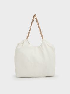 This product is made with at least 20% sustainable materials by weight. CHARLES & KEITH uses recycled, degradable, organic, and water-based materials in our eco-conscious collection.In match-all white, this neutral-toned iteration of our braided handle tote bag will slot seamlessly into your wardrobe rotation. With a magnetic closure that opens to reveal a extra large and capacious interior and gold-toned braided chain double handles that are edgy and chic at once, this bag has all the makings of a style staple that you will want to use on repeat. Size Chart For Kids, Brand Collaboration, White Tote, Consumer Protection, Charles Keith, Red Cross, On Repeat, Belt Size, White Bag