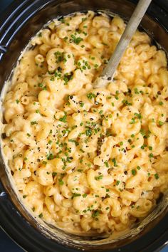 the macaroni and cheese is being cooked in the crock pot