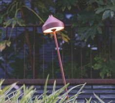 a lamp that is sitting in the grass