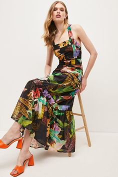 With all the charm of a well put-together bouquet, this vibrant maxi dress shows off bold sprays of tropical blooms printed onto soft, lightweight fabric. Flowing down to the floor, it guarantees a dramatic entrance and features a feminine halter neckline, crossover back straps and subtle textured trims lining the tiers. Tie the bow at the back in a ladylike loop for a final head-turning flourish. Finding Style, Dark Tropical, Dramatic Entrance, Latest Maxi Dresses, Album Aesthetic, Maxi Dress Collection, Tropical Prints, Island Fashion, Semi Formal Dress