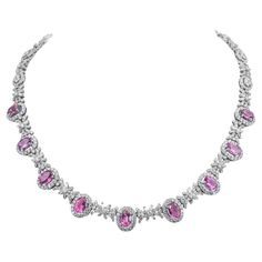 Featuring 9 oval-shaped bubblegum pink sapphires, set with oval-cut diamonds, round brilliant-cut diamonds and baguette-cut diamonds. Sapphires weighing a total of approximately 7 carats Diamonds weighing a total of approximately 13 carats 18 karat white gold Luxury Pink Baguette Diamond Jewelry, Luxury Pink Gold Necklaces With Pink Sapphire, Grandma Outfit, Platinum Necklace, Gelang Manik, Purple Sapphire, Precious Jewels, Expensive Jewelry, Baguette Cut Diamond