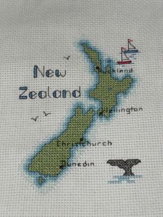 a cross stitch map of new zealand