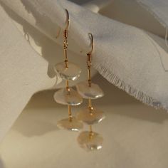 *Limited edition* Keshi pearls on 14k yellow gold filled ear hooks Each pearl is a unique keshi style Pearls about 1/2" wide Handmade Yellow Gold Pearl Earrings, 14k Gold Filled Pearl White Dangle Pearl Earrings, Handmade Dangle Pearl Earrings In 14k Gold Filled, Handmade 14k Gold-filled Dangle Pearl Earrings, Handmade 14k Gold Filled Dangle Pearl Earrings, Handmade Yellow Gold Earrings With Baroque Pearls, Pearl White Drop Pearl Earrings In 14k Gold Filled, Handmade Yellow Gold Baroque Pearl Earrings, Pearl White 14k Gold Filled Drop Earrings